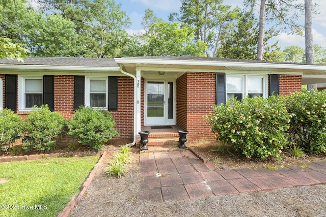 780 Leslie Campbell Ave, Lillington, NC 27546 - view of front of house featuring brick siding and roof with shingles