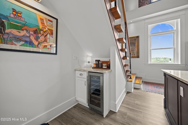 183 W Main St Unit 205, Washington, NC 27889 - indoor dry bar with beverage cooler, wood finished floors, stairway, and vaulted ceiling