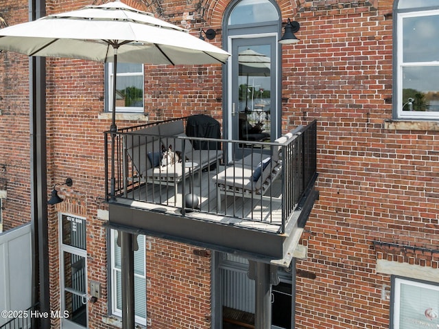 183 W Main St Unit 205, Washington, NC 27889 - doorway to property featuring brick siding and a balcony