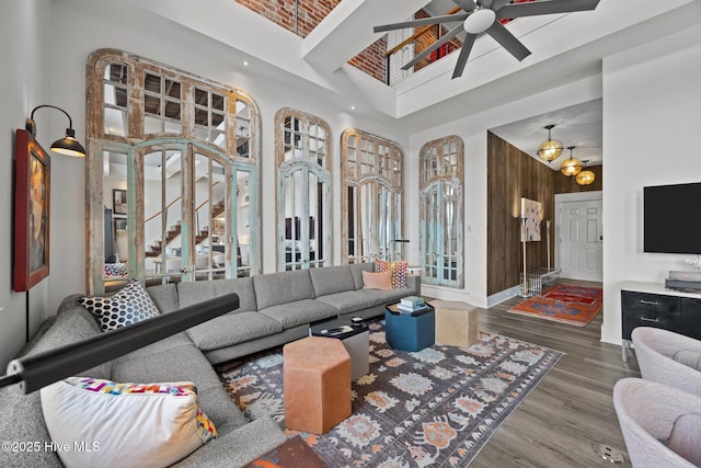 183 W Main St Unit 205, Washington, NC 27889 - living area featuring a towering ceiling, wood finished floors, and a ceiling fan