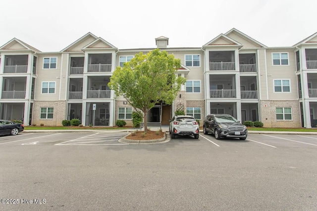 395 S Crow Creek Dr NW Unit 1615, Calabash, NC 28467 - view of building exterior featuring uncovered parking