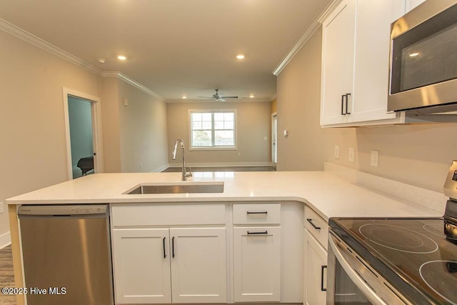 395 S Crow Creek Dr NW Unit 1615, Calabash, NC 28467 - kitchen featuring appliances with stainless steel finishes, a sink, ornamental molding, white cabinetry, and recessed lighting