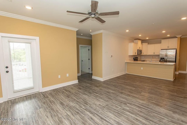 395 S Crow Creek Dr NW Unit 1615, Calabash, NC 28467 - unfurnished living room featuring crown molding, baseboards, wood finished floors, ceiling fan, and recessed lighting