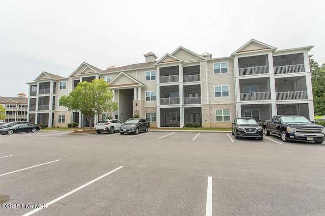 395 S Crow Creek Dr NW Unit 1615, Calabash, NC 28467 - view of building exterior featuring uncovered parking