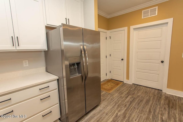 395 S Crow Creek Dr NW Unit 1615, Calabash, NC 28467 - kitchen featuring stainless steel refrigerator with ice dispenser, crown molding, white cabinetry, wood finished floors, and light countertops
