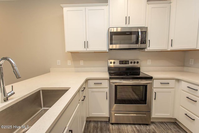 395 S Crow Creek Dr NW Unit 1615, Calabash, NC 28467 - kitchen featuring appliances with stainless steel finishes, a sink, white cabinetry, and light countertops