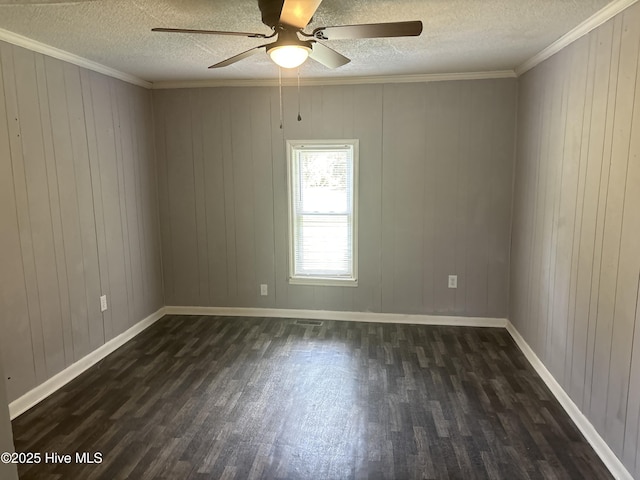 119 Alert Cable Rd, Dudley, NC 28333 - spare room featuring dark wood-style floors, a ceiling fan, a textured ceiling, crown molding, and baseboards