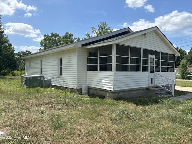 119 Alert Cable Rd, Dudley, NC 28333 - view of side of property with a sunroom, cooling unit, and entry steps