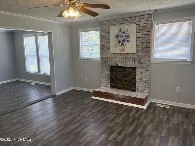 119 Alert Cable Rd, Dudley, NC 28333 - unfurnished living room with crown molding, wood finished floors, a ceiling fan, a textured ceiling, and baseboards