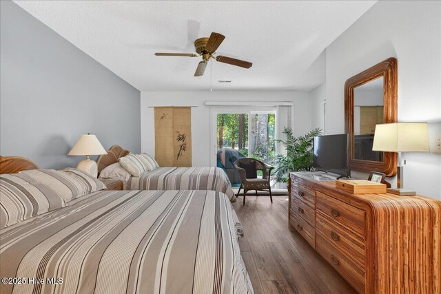 354 Sea Trail Dr E Unit 2, Sunset Beach, NC 28468 - bedroom with wood finished floors and ceiling fan