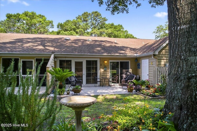 354 Sea Trail Dr E Unit 2, Sunset Beach, NC 28468 - back of property featuring a patio area and a shingled roof
