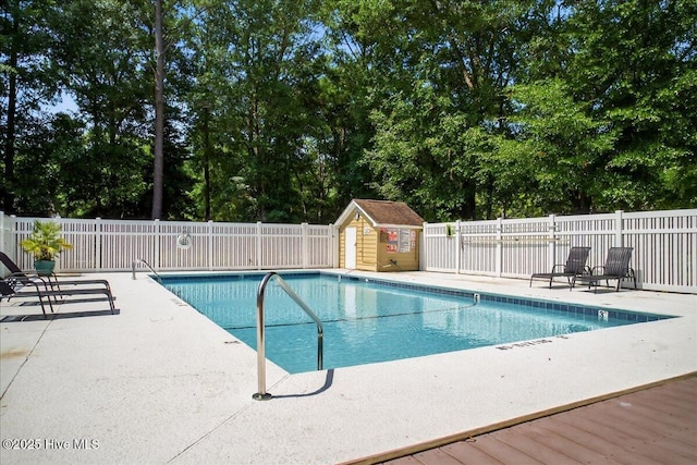 354 Sea Trail Dr E Unit 2, Sunset Beach, NC 28468 - community pool featuring a patio and view of scattered trees