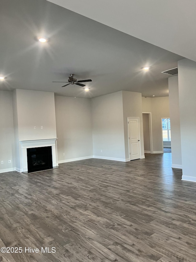 5046 Holly Hill Ct Lot 23, Battleboro, NC 27809 - unfurnished living room featuring dark wood finished floors, baseboards, a ceiling fan, a fireplace, and recessed lighting