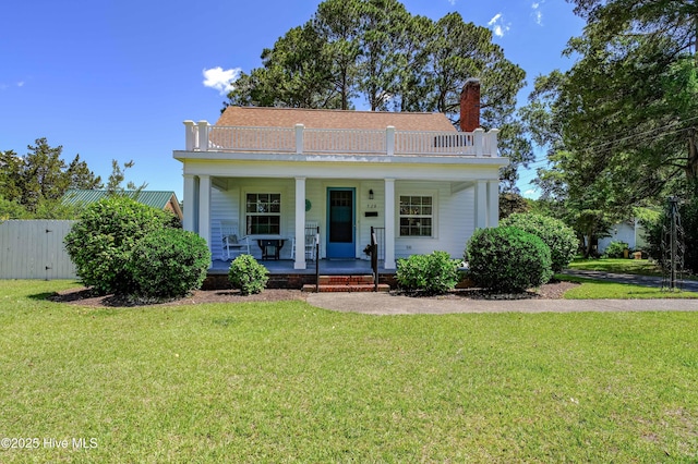 528 E 6th St, Washington, NC 27889 - view of front of home featuring a chimney and covered porch