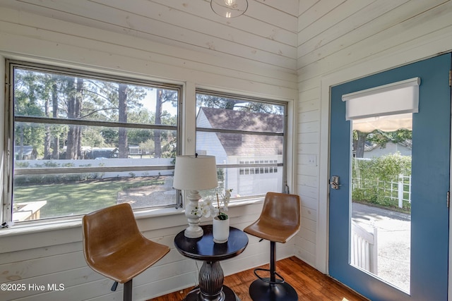 528 E 6th St, Washington, NC 27889 - sitting room with plenty of natural light, wood finished floors, and wooden walls