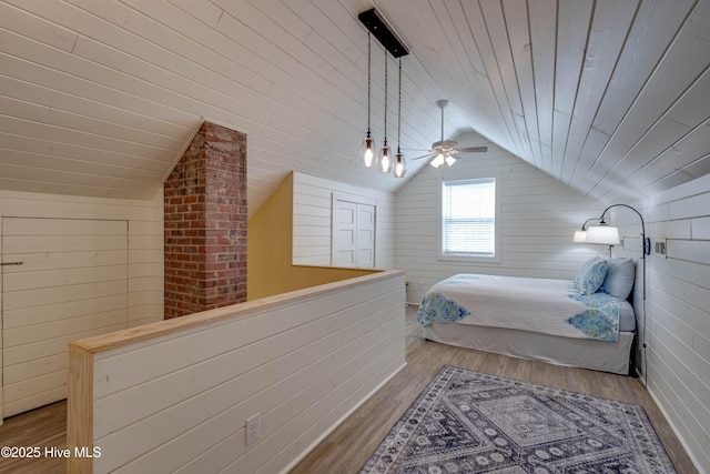 528 E 6th St, Washington, NC 27889 - bedroom featuring lofted ceiling, wood finished floors, wooden ceiling, and wooden walls