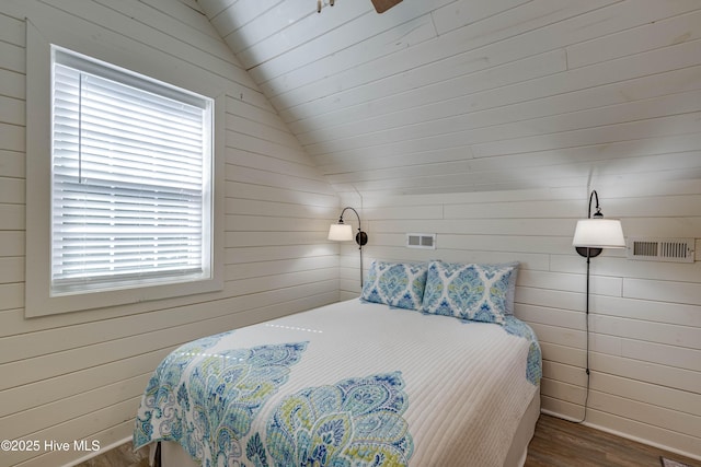 528 E 6th St, Washington, NC 27889 - bedroom featuring wood finished floors, lofted ceiling, and wooden walls
