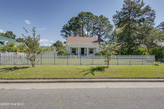 528 E 6th St, Washington, NC 27889 - bungalow featuring a fenced front yard, a chimney, and a porch