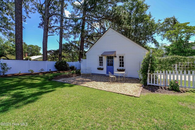 528 E 6th St, Washington, NC 27889 - back of house featuring a fenced backyard and a patio