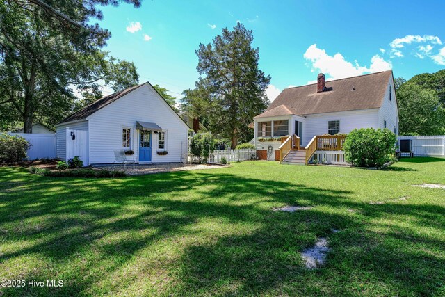 528 E 6th St, Washington, NC 27889 - rear view of property with a chimney, a wooden deck, a sunroom, and stairway