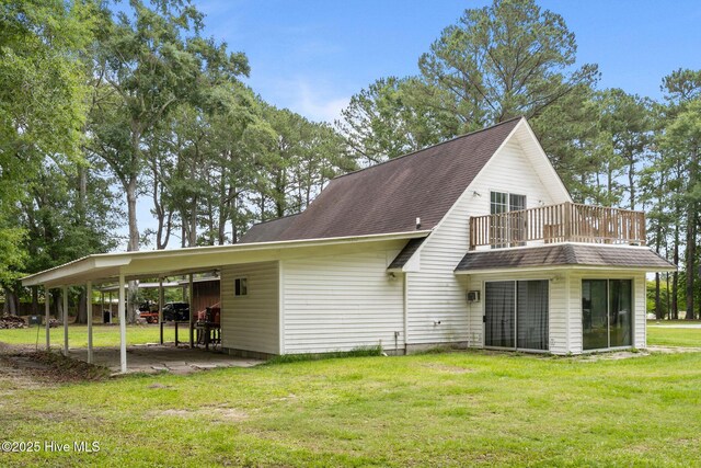 4967 E NC-24 Hwy, Beulaville, NC 28518 - back of property with a balcony, a lawn, and a shingled roof