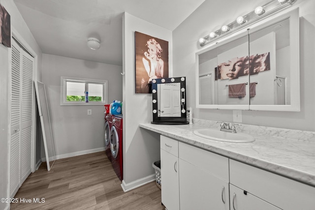 4967 E NC-24 Hwy, Beulaville, NC 28518 - full bathroom with washing machine and dryer, a closet, vanity, wood finished floors, and baseboards