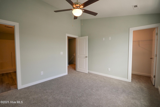 332 Starfish Ln, Sneads Ferry, NC 28460 - unfurnished bedroom featuring a walk in closet, carpet floors, high vaulted ceiling, a closet, and ceiling fan