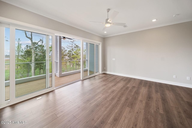2593 Alvernia Dr, Castle Hayne, NC 28429 - empty room featuring ceiling fan, crown molding, wood finished floors, baseboards, and a smoke detector