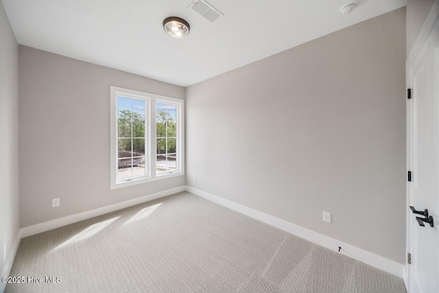 2593 Alvernia Dr, Castle Hayne, NC 28429 - carpeted spare room with baseboards and a smoke detector