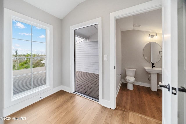 2593 Alvernia Dr, Castle Hayne, NC 28429 - bathroom with lofted ceiling, wood finished floors, toilet, and baseboards