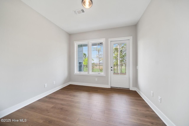 2593 Alvernia Dr, Castle Hayne, NC 28429 - spare room featuring baseboards and dark wood-style flooring