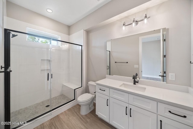 2593 Alvernia Dr, Castle Hayne, NC 28429 - full bathroom with toilet, vanity, a shower stall, and wood finished floors