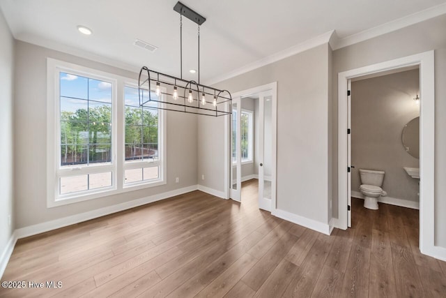 2593 Alvernia Dr, Castle Hayne, NC 28429 - unfurnished dining area featuring baseboards, a chandelier, crown molding, wood finished floors, and recessed lighting
