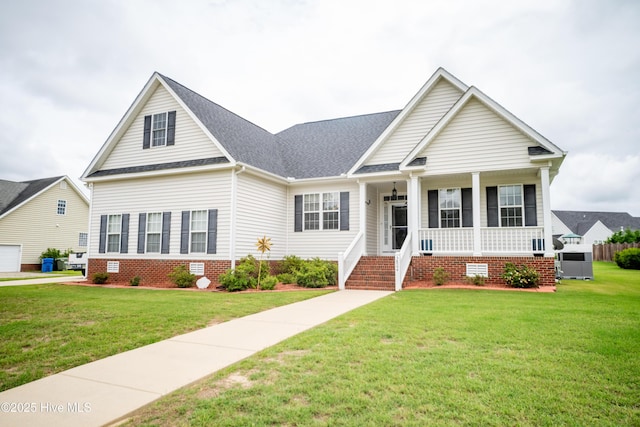 3804 Wyattwood Dr N, Wilson, NC 27896 - view of front facade featuring covered porch, a front lawn, crawl space, and a shingled roof
