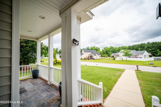 3804 Wyattwood Dr N, Wilson, NC 27896 - covered porch with a residential view and a lawn