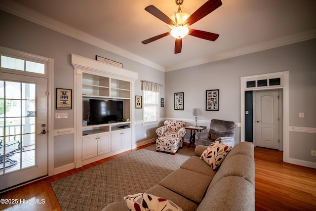 3804 Wyattwood Dr N, Wilson, NC 27896 - living room featuring plenty of natural light, wood finished floors, crown molding, ceiling fan, and baseboards