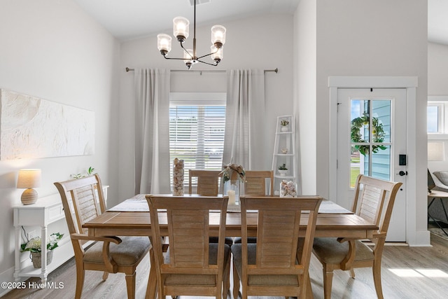 2968 Hatchers Run, Leland, NC 28451 - dining area featuring light wood-style flooring, a chandelier, and lofted ceiling