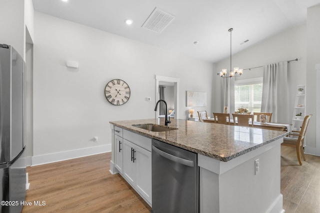 2968 Hatchers Run, Leland, NC 28451 - kitchen with appliances with stainless steel finishes, a sink, light wood-style floors, hanging light fixtures, and lofted ceiling