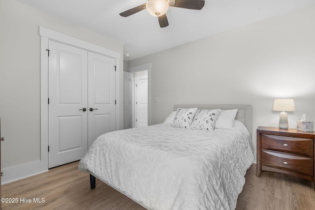 2968 Hatchers Run, Leland, NC 28451 - bedroom with wood finished floors, a closet, a ceiling fan, and baseboards