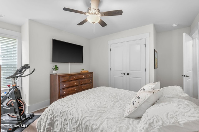 2968 Hatchers Run, Leland, NC 28451 - bedroom featuring a closet, baseboards, wood finished floors, and ceiling fan