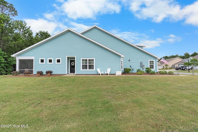 2968 Hatchers Run, Leland, NC 28451 - rear view of house with a lawn