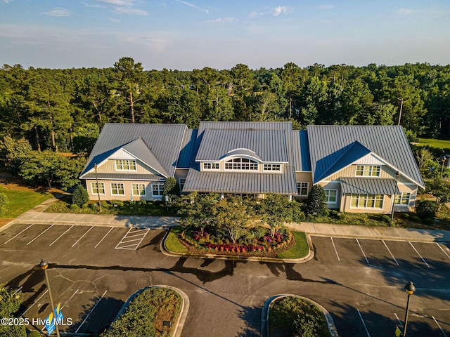 2968 Hatchers Run, Leland, NC 28451 - view of building exterior featuring uncovered parking and a wooded view