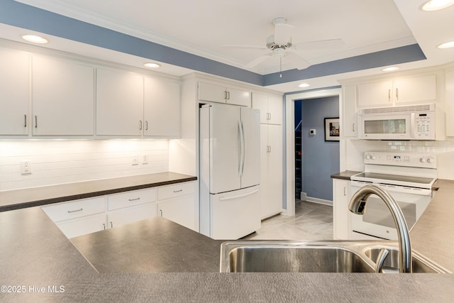 786 Wild Oak Ln NW, Calabash, NC 28467 - kitchen with white appliances, ceiling fan, dark countertops, recessed lighting, and decorative backsplash