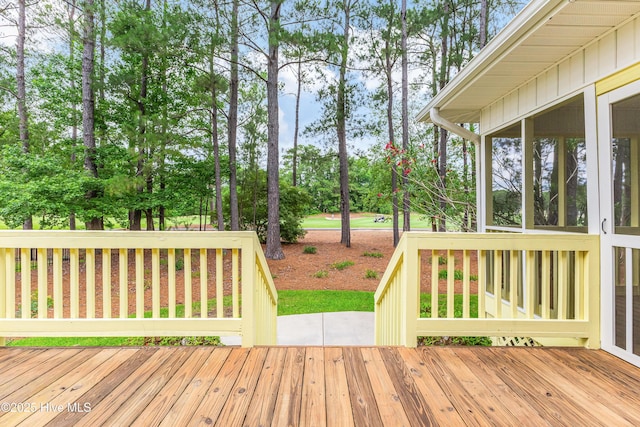 786 Wild Oak Ln NW, Calabash, NC 28467 - wooden deck with view of wooded area and a sunroom