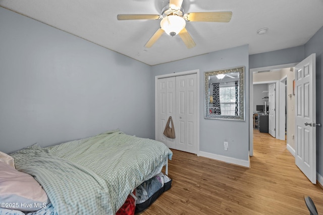 3106 John Willis Rd, New Bern, NC 28562 - bedroom featuring baseboards, wood finished floors, a closet, and ceiling fan