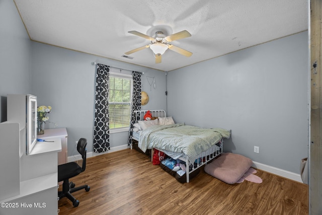 3106 John Willis Rd, New Bern, NC 28562 - bedroom featuring an office area, wood finished floors, and baseboards