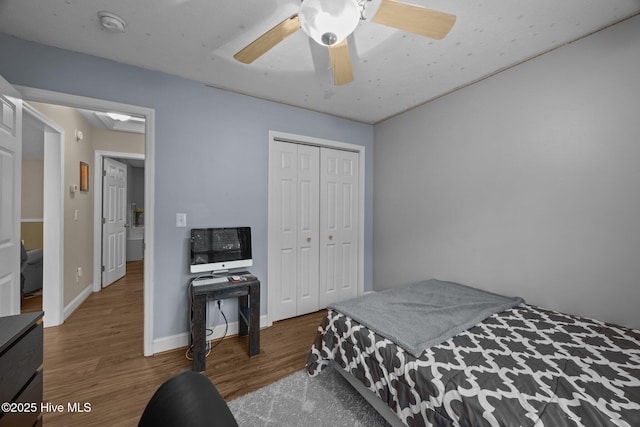3106 John Willis Rd, New Bern, NC 28562 - bedroom featuring wood finished floors, a closet, ceiling fan, and baseboards
