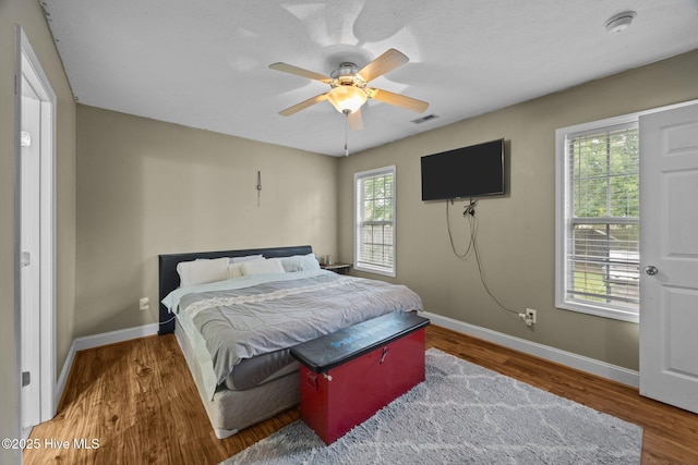 3106 John Willis Rd, New Bern, NC 28562 - bedroom featuring baseboards, wood finished floors, and ceiling fan
