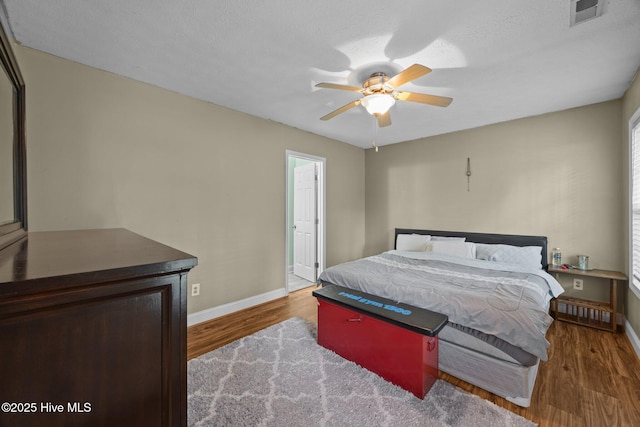 3106 John Willis Rd, New Bern, NC 28562 - bedroom featuring baseboards, wood finished floors, and a ceiling fan