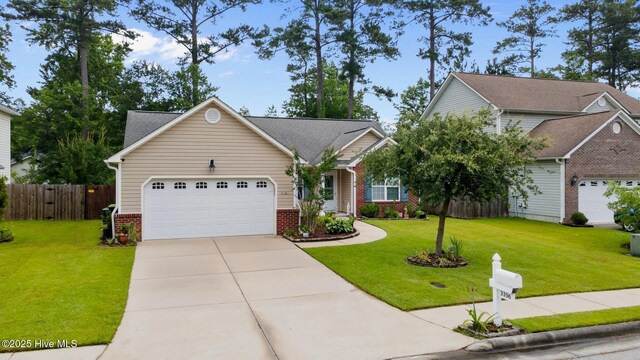 3106 John Willis Rd, New Bern, NC 28562 - view of front of house with brick siding, an attached garage, and driveway